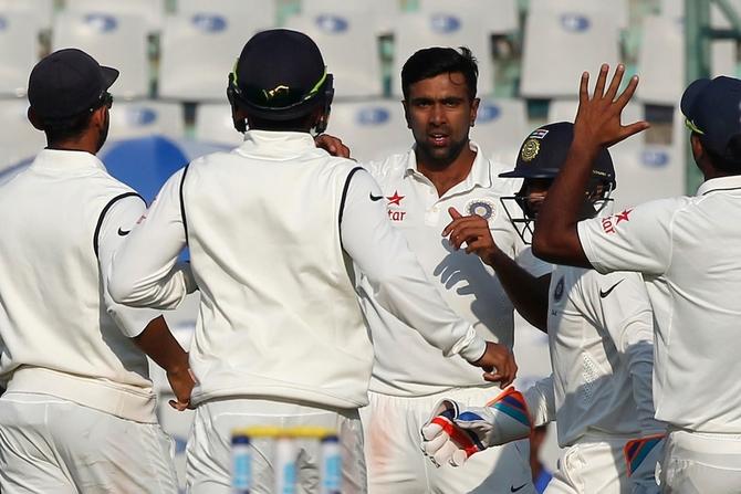 Parthiv Patel, second from right, in the thick of action in his first Test in eight years. Photograph: BCCI