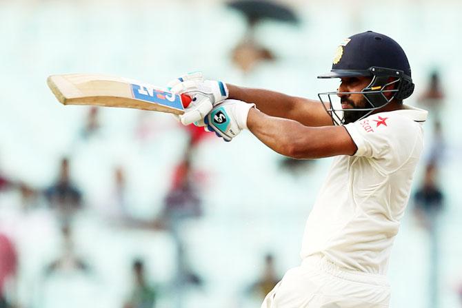  India's Rohit Sharma plays a pull shot on Day 3 