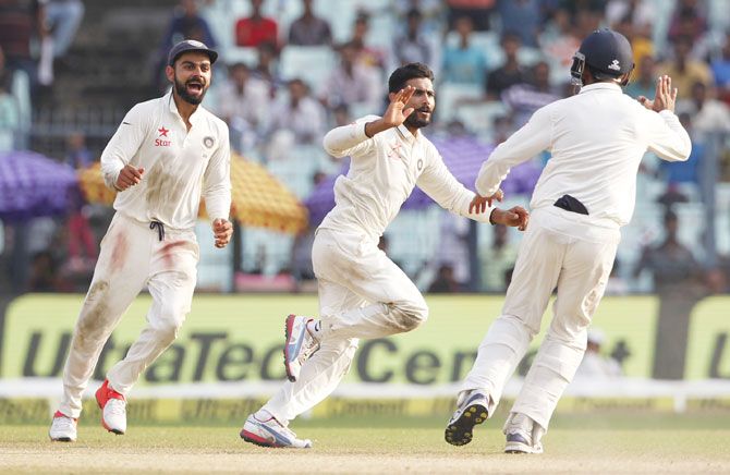 India's Ravindra Jadeja (centre) celebrates the wicket of New Zealand's Luke Ronchi