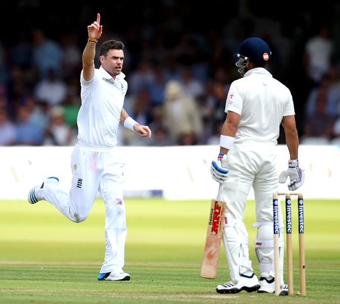: England fast bowler James Anderson, left, celebrates after taking the wicket of Virat Kohli during the second Test at Lord's on July 17, 2014