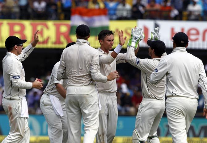 New Zealand's players celebrate the wicket of Gautam Gambhir