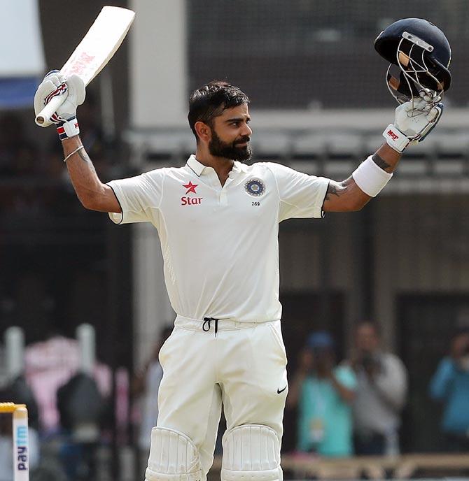 Virat Kohli celebrates after scoring a double century