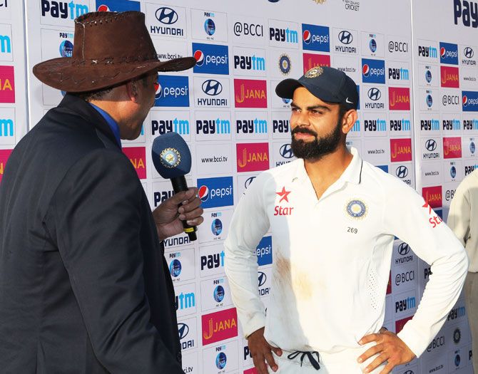 Virat Kohli speaks to Ravi Shastri at the post-match press conference