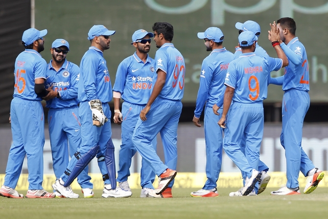 Hardik Pandya of India celebrates his maiden ODI wicket after dismissing Martin Guptill of New Zealand