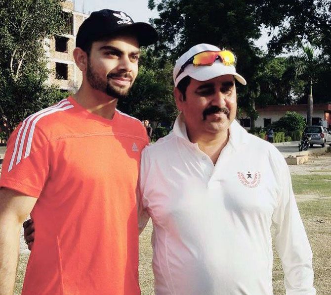 A young Virat with his coach, Raj Kumar