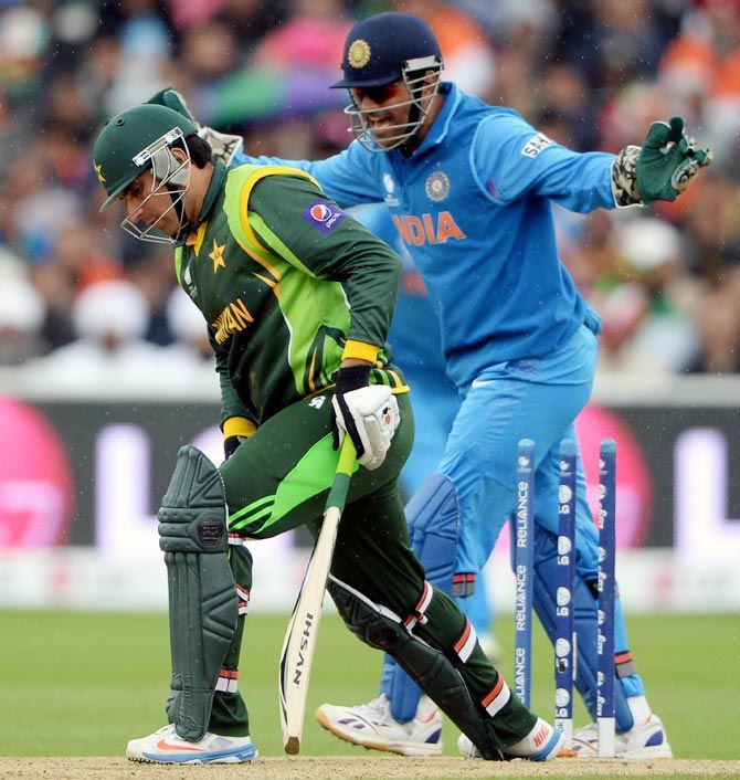 Mahendra Singh Dhoni celebrates Misbah-ul Haq's wicket during the ICC Champions Trophy game at Edgbaston. Photograph: Gareth Copley/Getty Images
