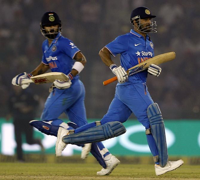 Virat Kohli (left) and Mahendra Singh Dhoni in the third ODI against New Zealand in Mohali