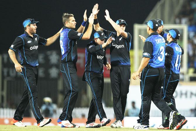 New Zealand players celebrate a wicket