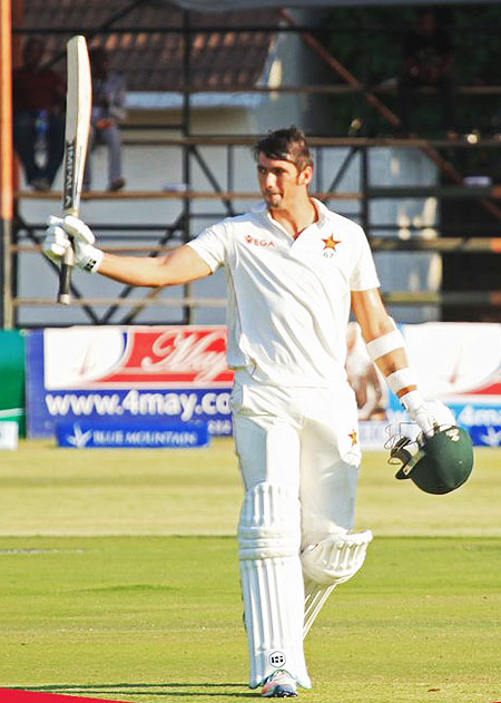 Zimbabwe captain Graeme Cremer celebrates on completing his maiden Test century against Sri Lanka in Harare on Monday