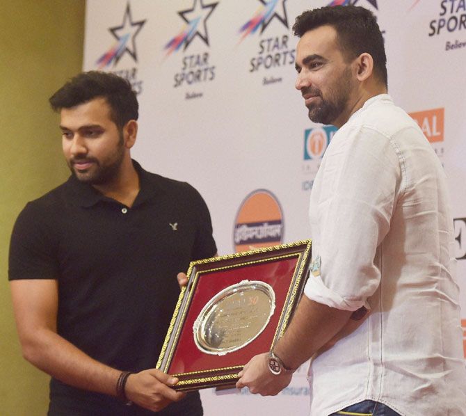 Cricketer Rohit Sharma is felicitated by former India pacer Zaheer Khan during the Sports Journalists Association of Mumbai’s (SJAM) Golden Jubilee Annual Awards 2016, in Mumbai on Saturday