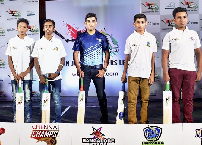Indian cricketer and Brand Ambassador of IJPL Gautam Gambhir with young players during the announcement of Indian Junior Player League (IJPL) T-20 tournament in New Delhi on Thursday