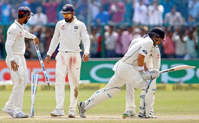 India's captain Virat Kohli (2nd from left) celebrates with teammates after winning the match