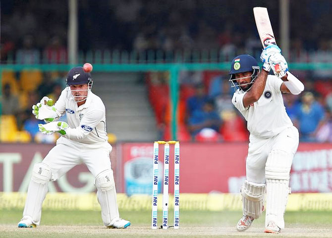 Cheteshwar Pujara bats during day 4 of the 1st Test in Kanpur on Sunday