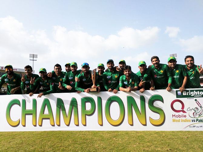 The Pakistan cricket team celebrate with the trophy after defeating West Indies in the fourth and final T20 to win the series 3-1