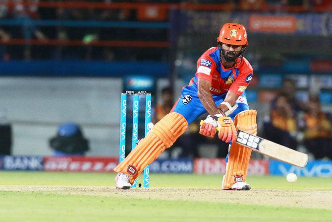 Dinesh Karthik plays a reverse sweep during his innings of 47 runs