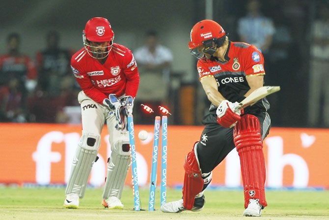 RCB captain Shane Watson is bowled by King's XI Punjab's Axar Patel during their IPL match in Indore on Monday