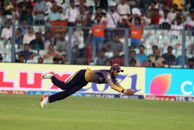 KKR's Manish Pandey takes a fine catch to send Suresh Raina back into the dug out