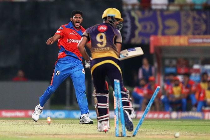 Gujarat Lions' Basil Thampi celebrates after cleaning up KKR's Manish Pandey