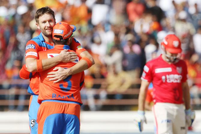 Gujarat Lions' Andrew Tye celebrates with captain Suresh Raina on dismissing Shaun Marsh