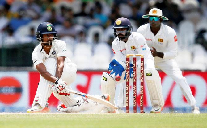 Wriddhiman Saha bats