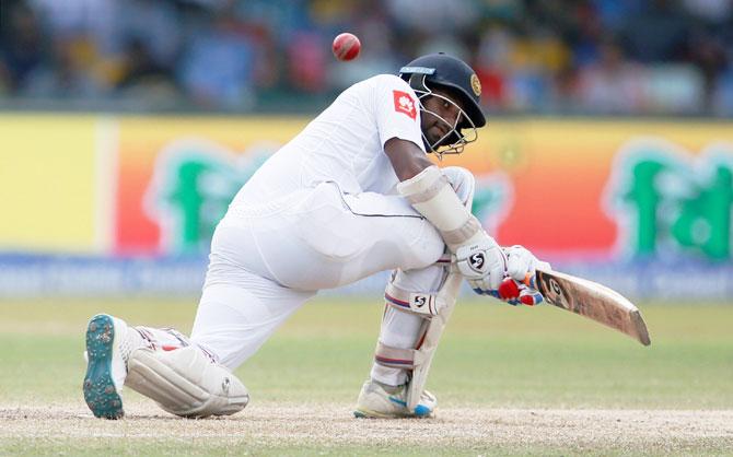 Sri Lanka's Dimuth Karunaratne hits a boundary