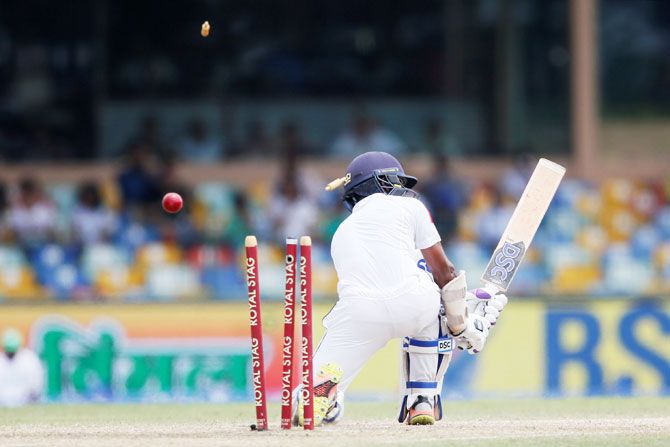 Sri Lanka's Niroshan Dickwella is bowled out by India's Mohammed Shami