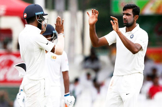 India's Ravichandran Ashwin celebrates with Lokesh Rahul after taking the wicket of Sri Lanka's Malinda Pushpakumara