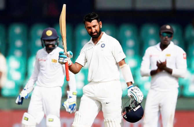India's Cheteshwar Pujara celebrates his century on Day 1 of the 2nd Test vs Sri Lanka in Colombo on Thursday