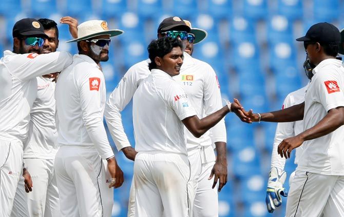 Lanka's chinaman bowler Lakshan Sandakan, centre, will be crucial to their chances