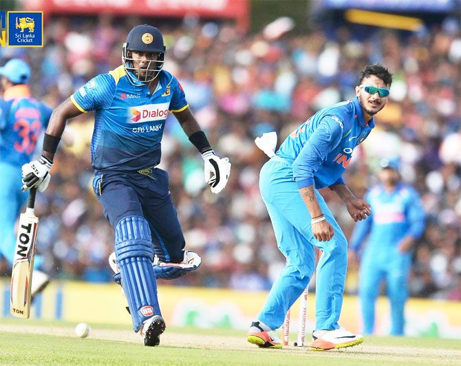 Axar Patel and Angelo Mathews in action 