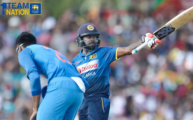 Sri Lanka opener Niroshan Dickwella celebrates on completing his half century