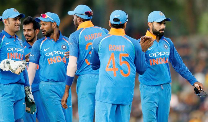 India's captain Virat Kohli celebrates with his teammates at the end of the Sri Lanka's innings