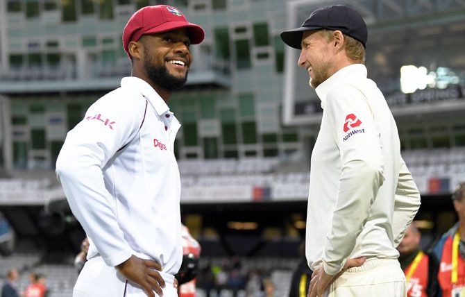 West Indies' Shai Hope and England captain Joe Root chat after the 2nd Test at Headingley in Leeds, on Tuesday