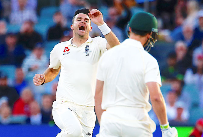 England's James Anderson celebrates after taking the wicket of Australia's Cameron Bancroft on the third day of the second Ashes cricket Test match at Adelaide Oval on Monday