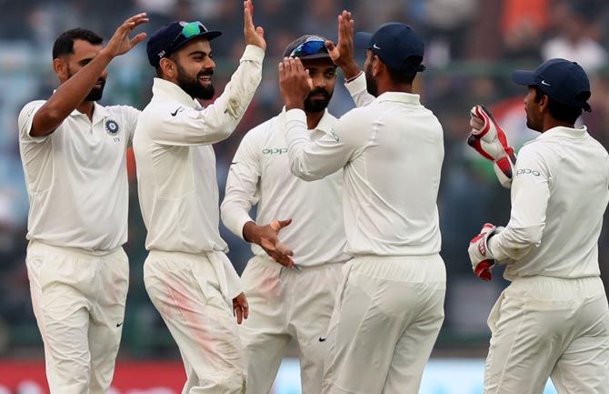Mohammed Shami celebrates with teammates after dismissing Sri Lanka's Suranga Lakmal on Day 3 of the 3rd Test at the Feroz Shah Kotla in New Delhi on Monday