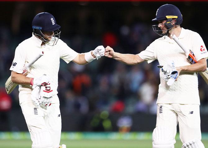 England's Joe Root (left) and Chris Woakes leave the ground at stumps on Day 4 of the second Ashes Test against Australia at Adelaide Oval in Adelaide on Tuesday