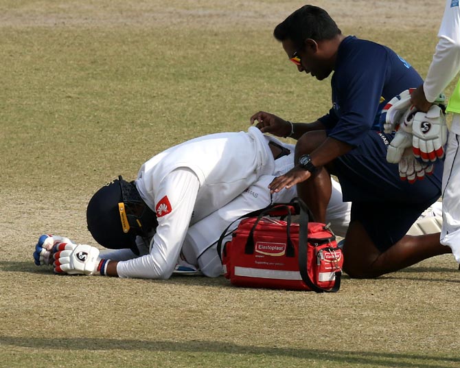Dhananjaya de Silva receives treatment from the team physio
