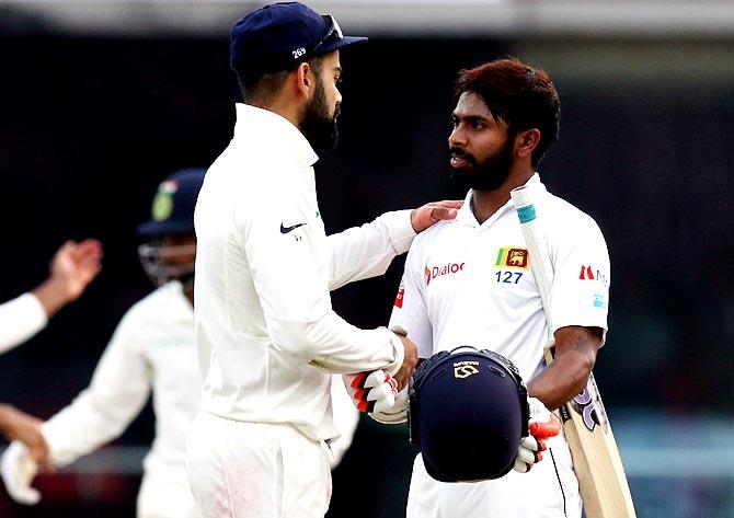 Virat Kohli greets Nirohan Dickwella at the end of the match