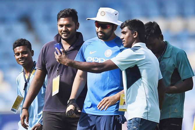 Ground staff at the stadium in Vizag take a selfie with India captain Rohit Sharma during a practice session on Saturday, the eve of the third and final ODI cricket match against Sri Lanka