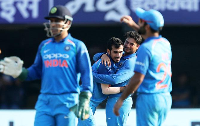 India's Kuldeep Yadav and Yuzvendra Chahal celebrate the wicket of Sri Lanka's Niroshan Dickwella during the 3rd ODI at the The ACA-VDCA Stadium, in Visakhapatnam on Sunday