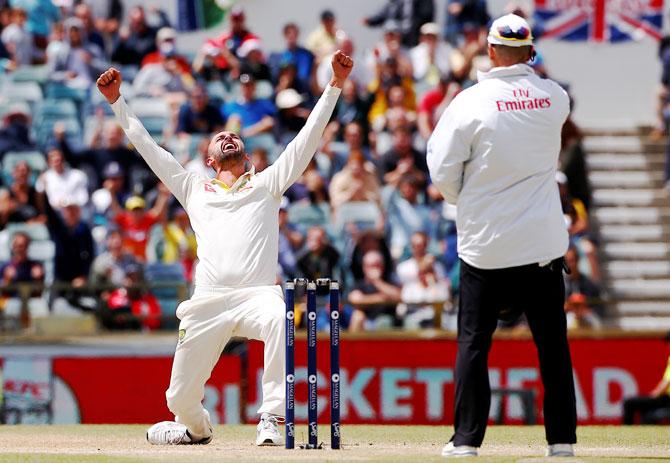 Australia's Nathan Lyon celebrates after dismissing England's Moeen Ali