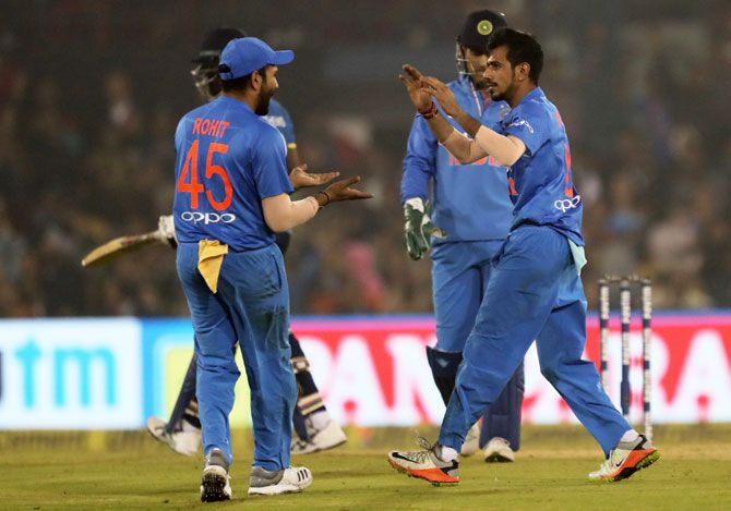 Yuzvendra Chahal celebrates with teammates after taking the wicket of Angelo Mathews 