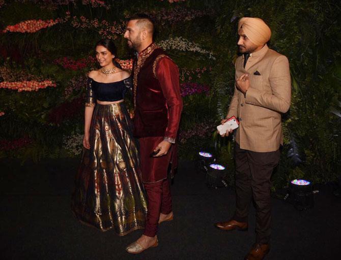 Yuvraj Singh greets actress Aditi Rao Hydari while Harbhajan Singh follows