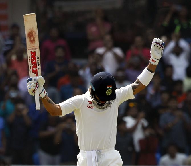 Virat Kohli celebrates on reaching his double century 