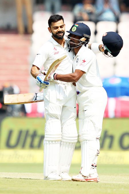 Wriddhiman Saha congratulates Virat Kohli after the Indian captain completed his double century on Friday