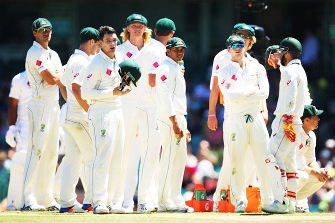 Australia players await a DRS decision on Day 5 of the 3rd Test against Pakistan on Saturday. Australia will travel to India with more or less the same bunch of players that played the series clean sweep over Pakistan