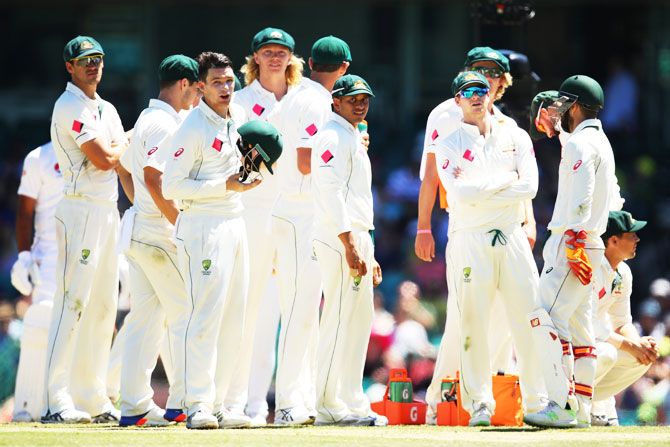 Australia players await a DRS decision on Day 5 of the 3rd Test against Pakistan on Saturday. Australia will travel to India with more or less the same bunch of players that played the series clean sweep over Pakistan
