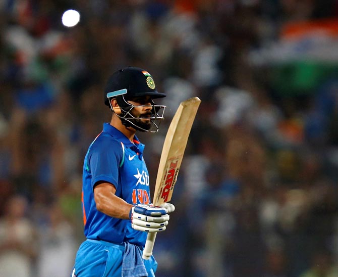 Virat Kohli celebrates his century during the first ODI in Pune on Sunday