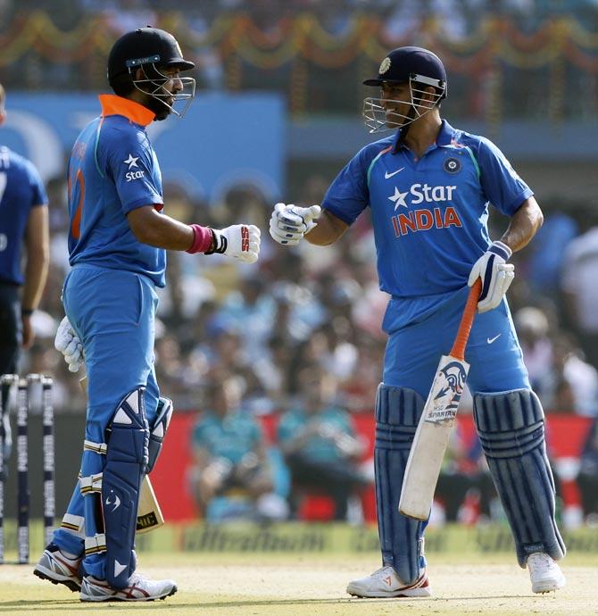 Yuvraj Singh, left, with Mahendra Singh Dhoni