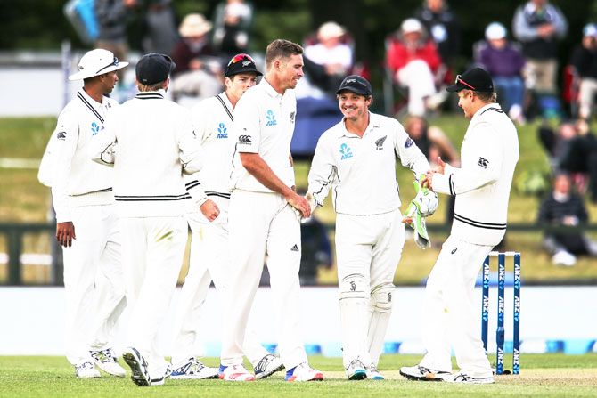New Zealand's Tim Southee (centre) of is congratulated by teammates after taking five wickets on Day 1 of the second Test match against Bangladesh at Hagley Oval in Christchurch, New Zealand, on Friday